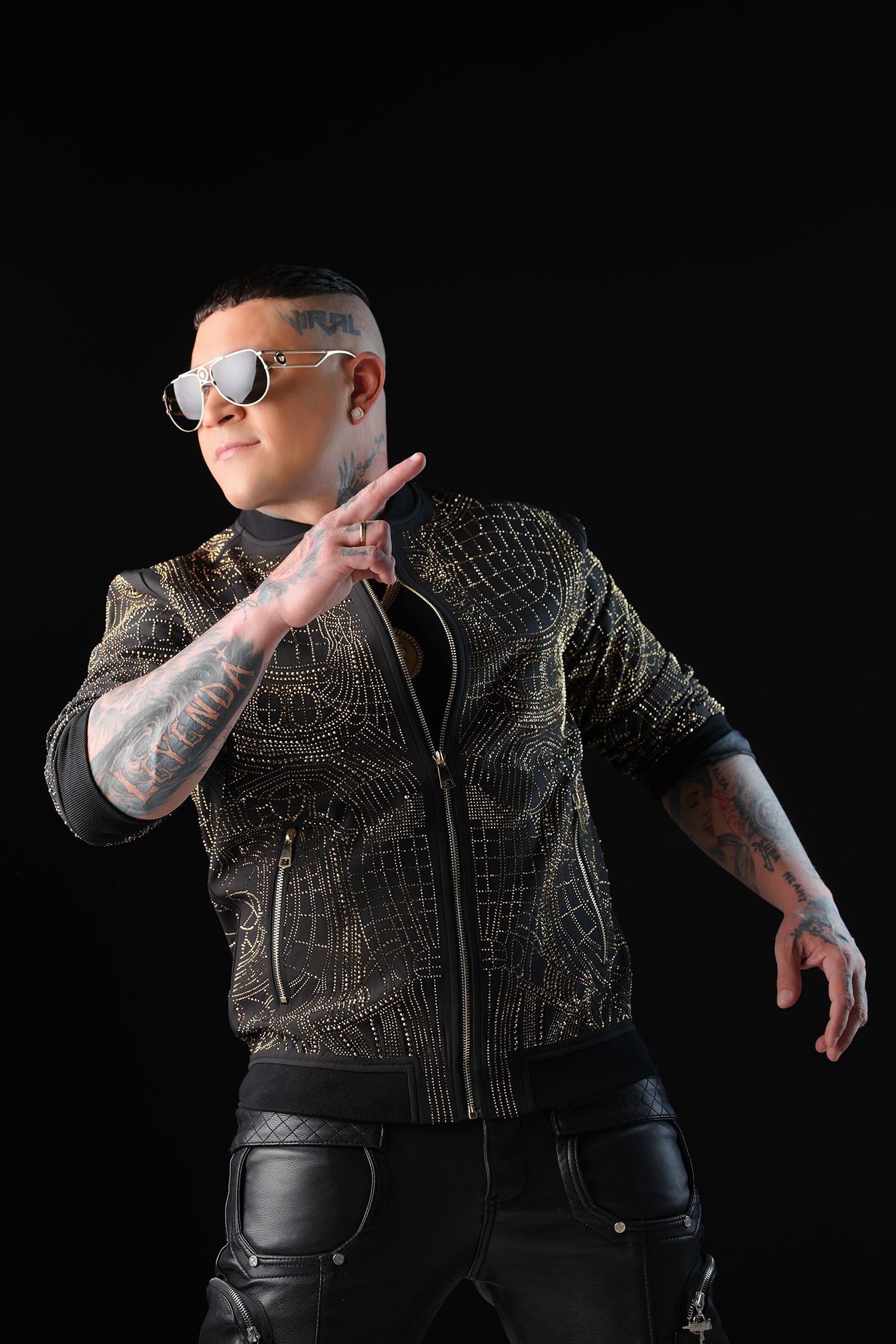 Man wearing BARABAS Jaggy Boy rhinestone bomber jacket, a signature luxury streetwear statement piece