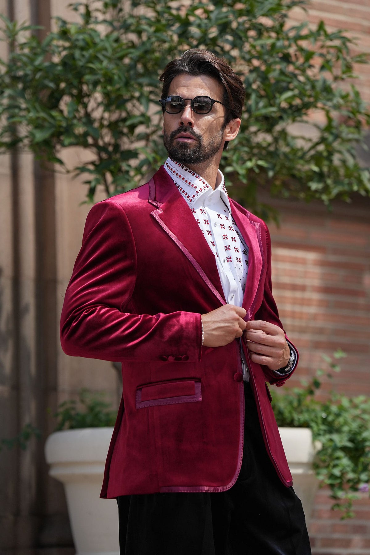 Man wearing a burgundy velvet blazer with a notch lapel, a style that works as a velvet tuxedo jacket alternative for holiday events